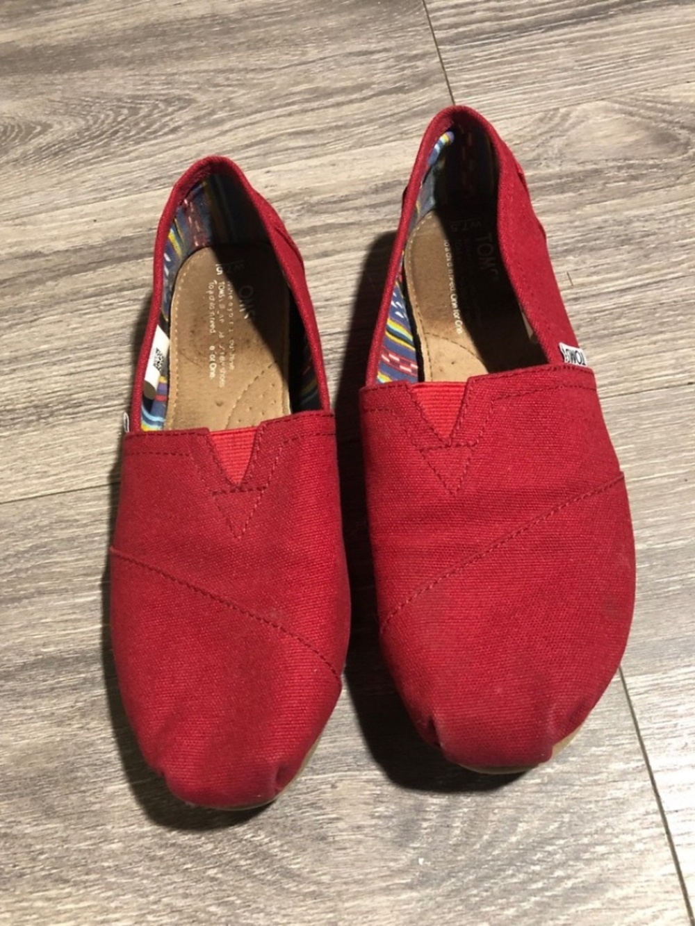 Toms Classic Slip-On flats, featuring a vibrant red canvas 7.5